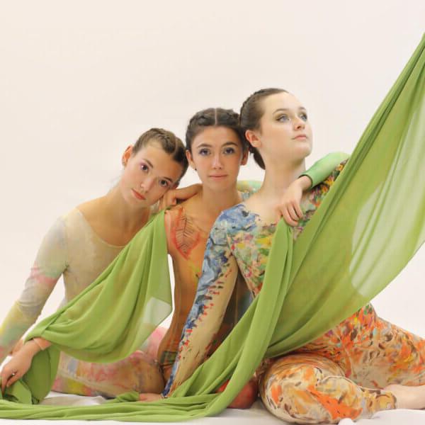 From left to right - Becca Hopkins, Eve Stanley and Lainey Griffin, wearing hand-painted costumes for Arte in Movimento 跳舞 company's "Walking Artwork" show. All three are Shenandoah graduates, and Stanley is the artistic director of the 跳舞 company.